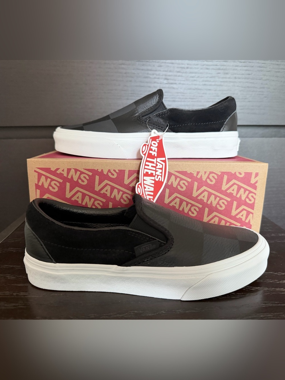 Vans Classic Slip-On Leather Sneakers - Black with Checkerboard finish.